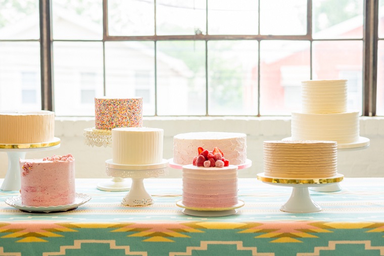 Table with 8 cakes on it